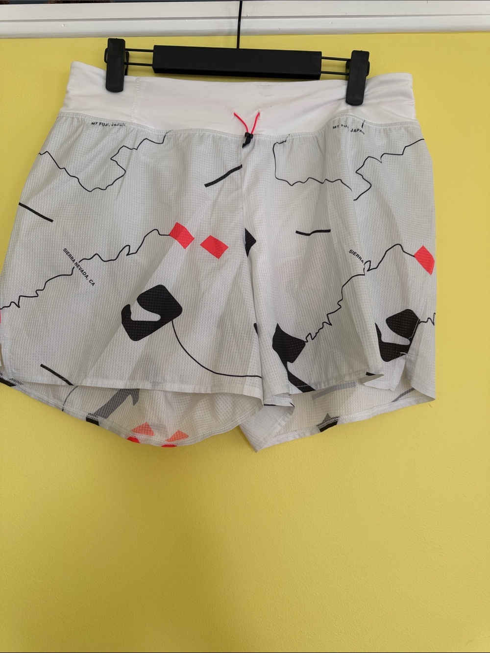 The North Face White Athletic Shorts with Black and Coral Accents